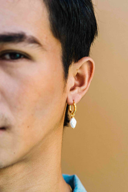 Male model styling 'MATAHARI' chunky gold vermeil hoops, shown without charms. This listing is for hoops only—charms sold separately.