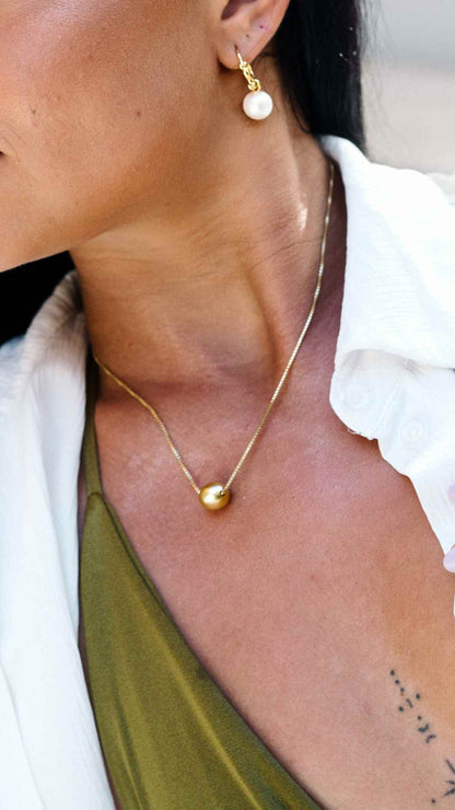 Close up of Gold South Sea Pearl Floating Necklace on Gold Vermeil Chain.